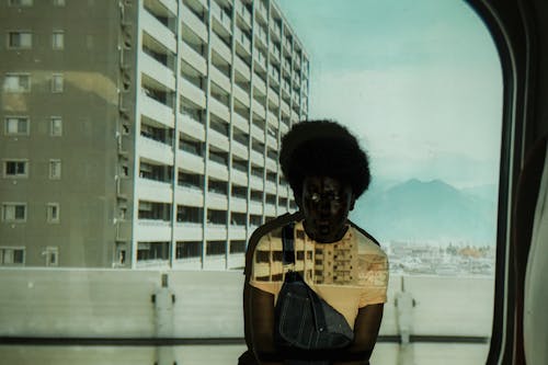 Man by the Wall with Building Background