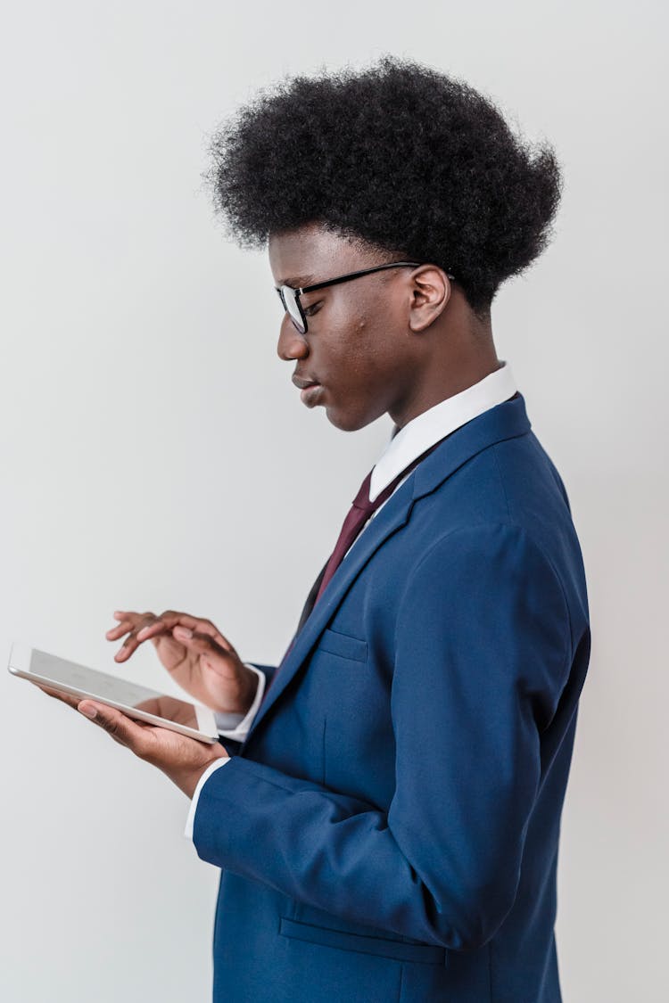 Side View Of A Boy Wearing Blue Suit