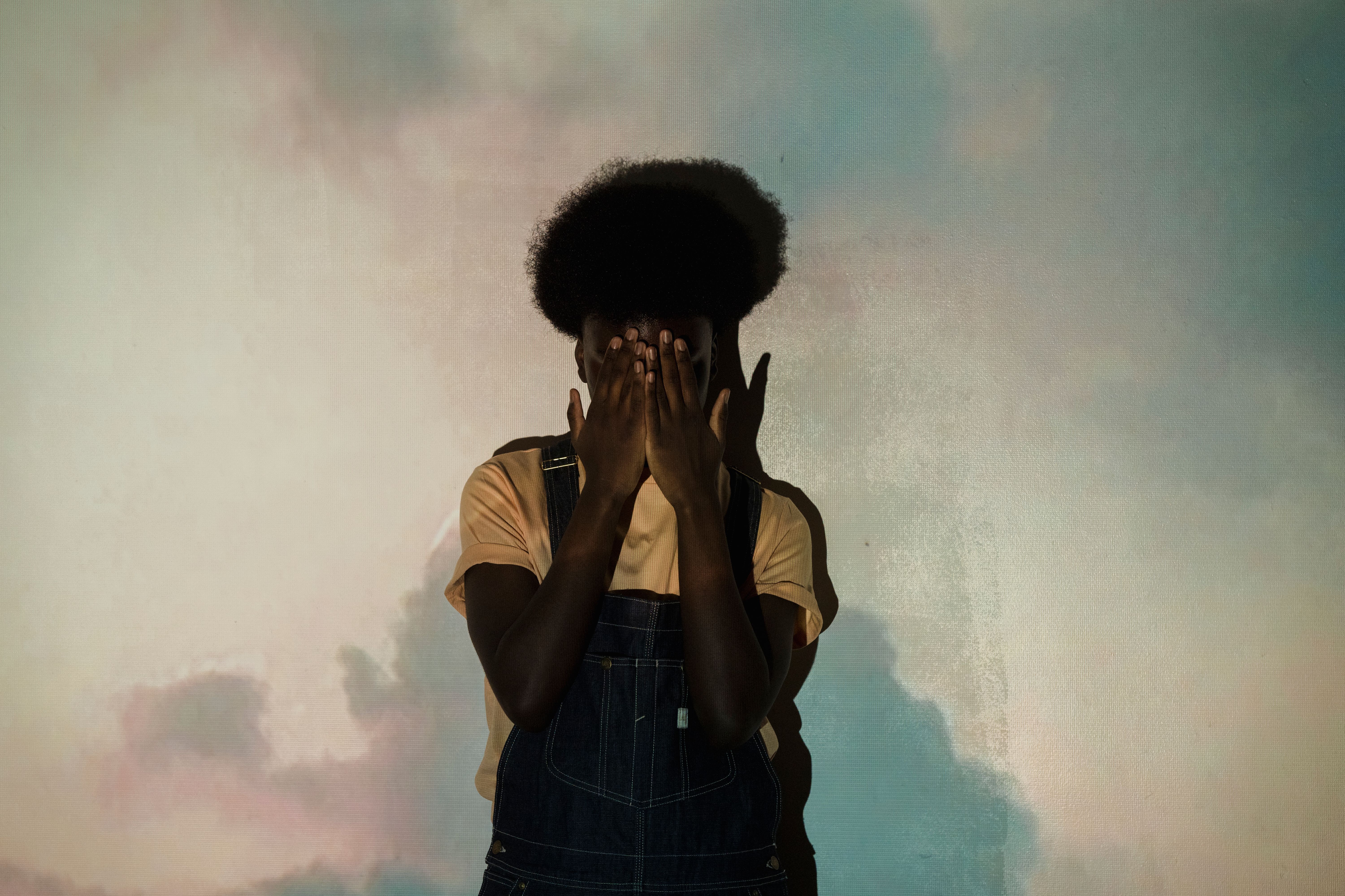 A Young Man Covering His Face · Free Stock Photo