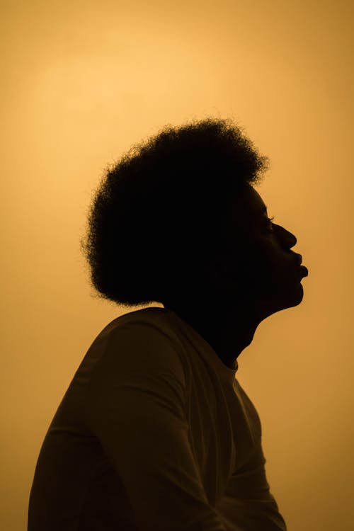 Free Man with Afro Hair Looking Up Stock Photo