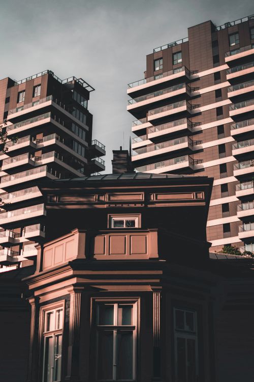 Free Striking contrast between contemporary high-rise apartments and classic building in Latvia. Stock Photo
