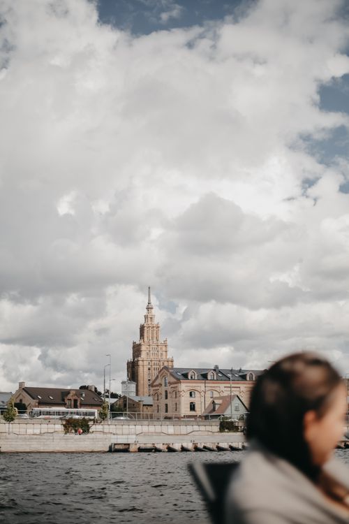 Free A picturesque shot of Riga's skyline with the iconic Latvian Academy of Sciences and Daugava River. Stock Photo