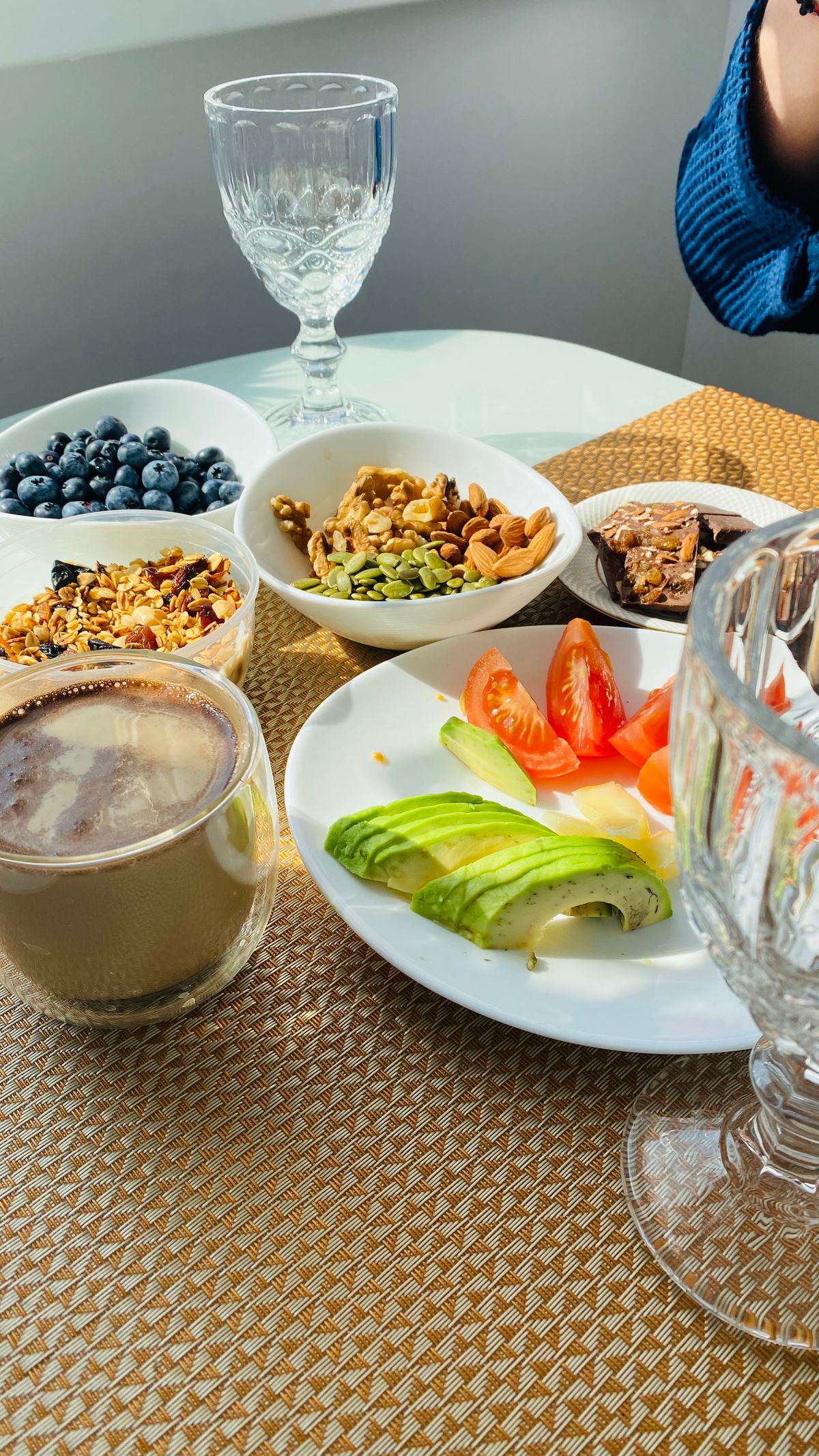 Fresh produce, salmon, walnuts, and other whole foods arranged on a table