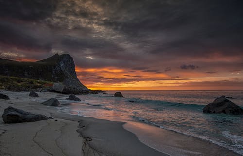  Rock Formation on Sea Shore During Sunset