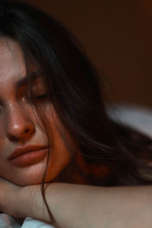 Free Close-up portrait of a woman with eyes closed, exuding tranquility and calm. Stock Photo