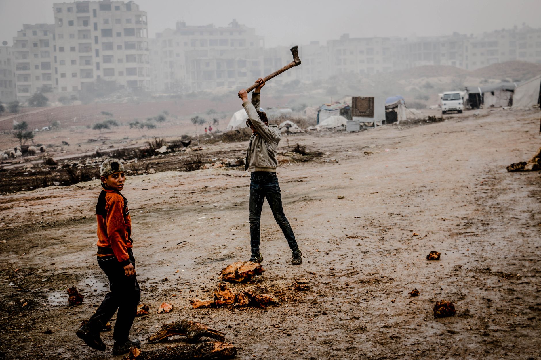 Scene of daily life in fog-covered Idlib, Syria, capturing urban struggle and resilience.