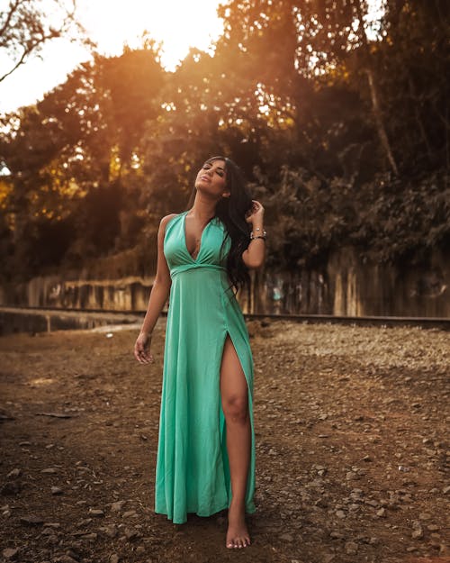 Woman in Green Dress Standing on the Ground