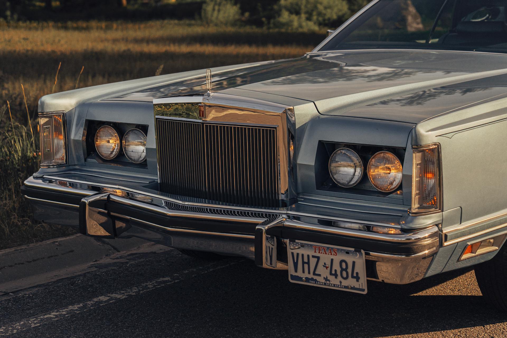 Front view of a vintage Lincoln Continental Mark V with classic design elements and Texas plate.