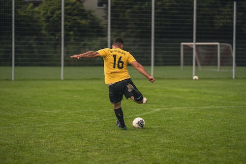 Football Player Kicking a Ball