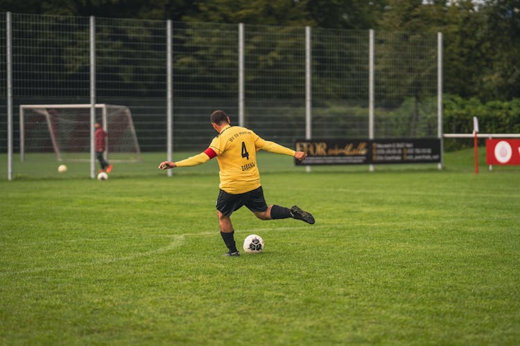 
A Man Kicking A Ball