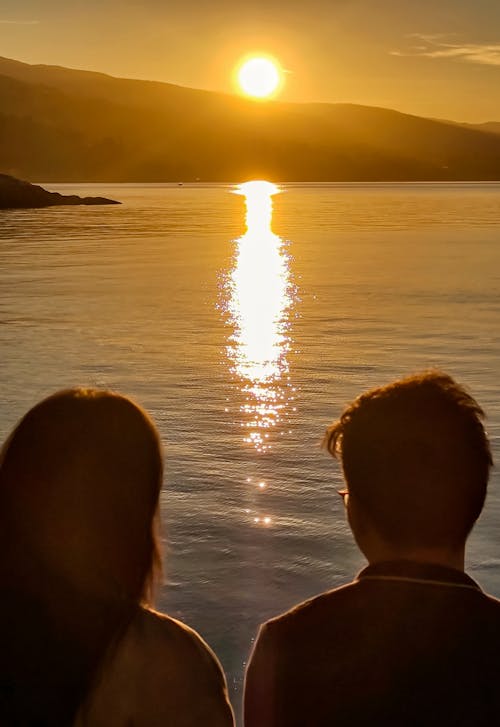 Free stock photo of asian couple, ocean, sunrise