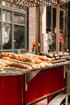 Grilled corn on a street food stall, capturing the urban dining experience.