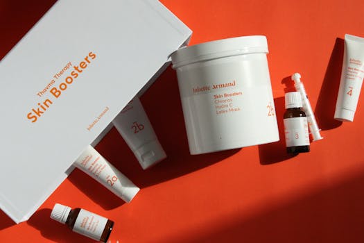 Discover the elegance of premium skin care with these boosters photographed on a vibrant red background.