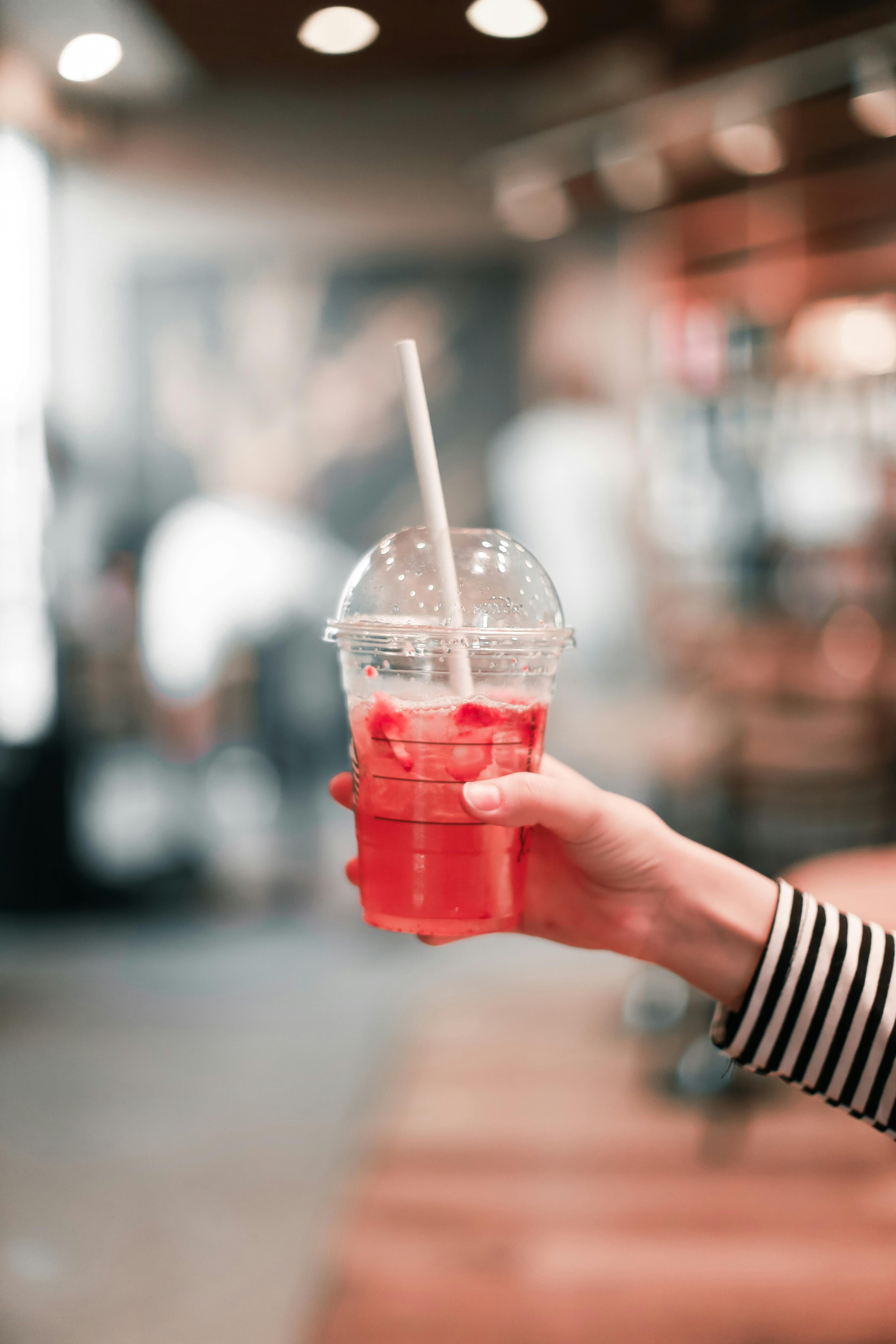 Red Disposable Cup For Beverages With Straw Stock Photo - Download