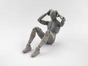 A Robot Figure Doing a Sit-up