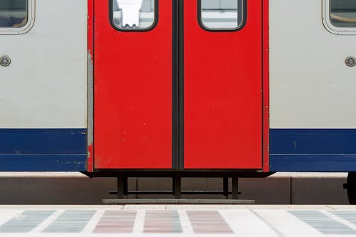 Train with Red Door at a Railway Station