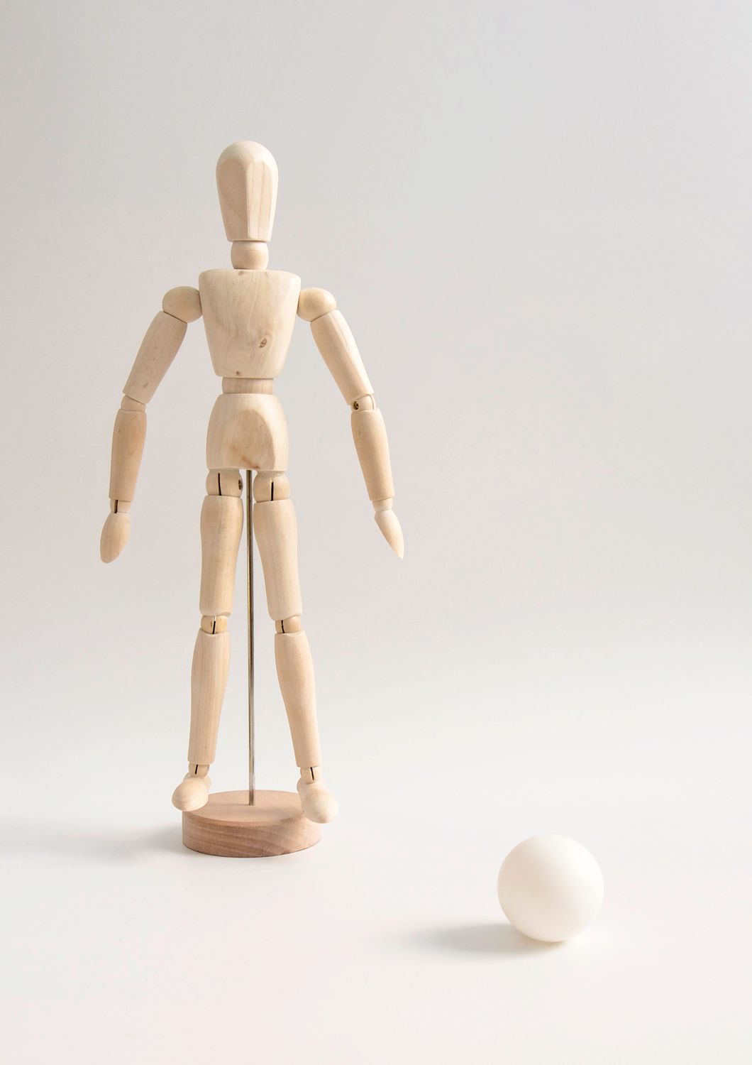 Close-Up Shot of a Wooden Human Figurine · Free Stock Photo
