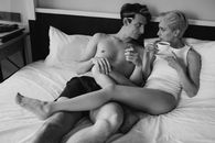 Woman in White Tank Top Lying on Bed