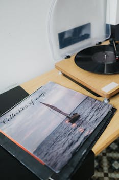 Retro turntable with a vinyl record and nostalgic album cover.