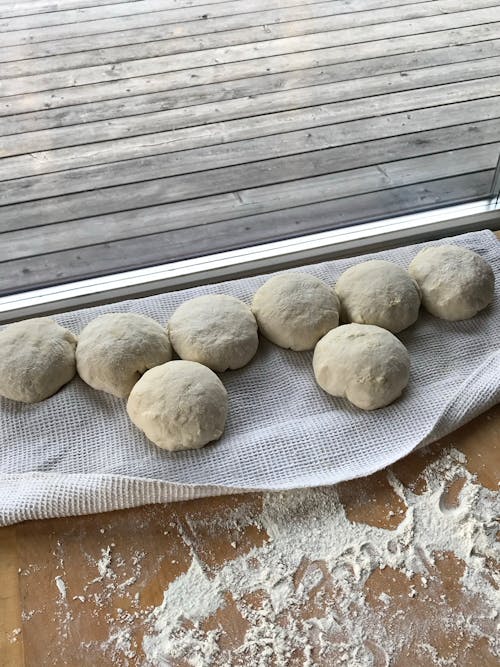 Three Brown Cookies on White Textile