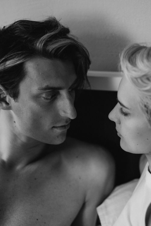 Free A close-up black and white photo of a couple sharing a tender and intimate moment. Stock Photo