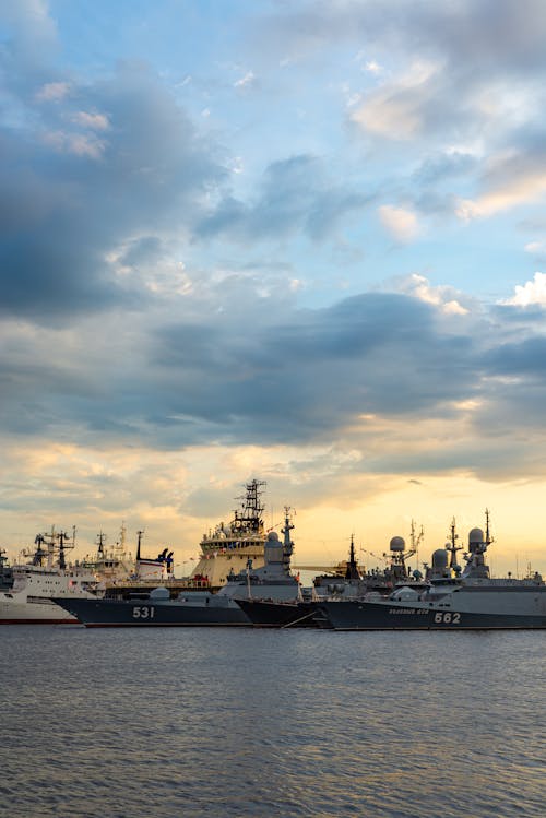 Military Vessels in Harbour at Sunset