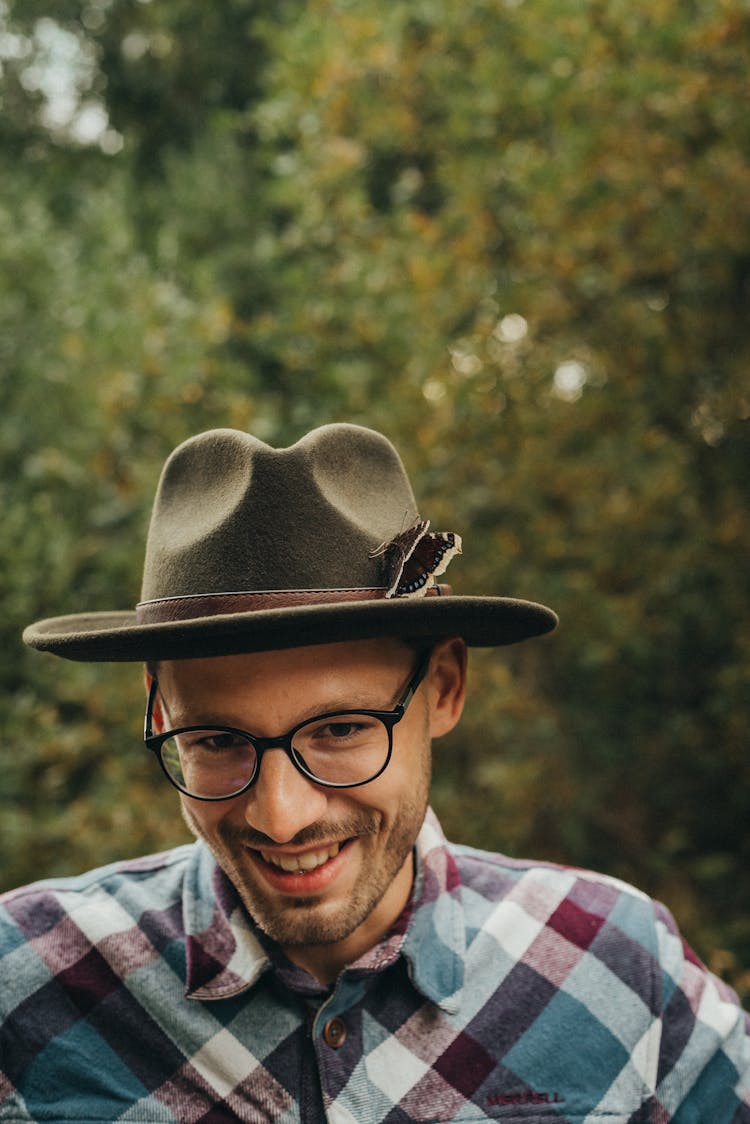 Butterfly Sitting On The Hat Of A Smiling Man 