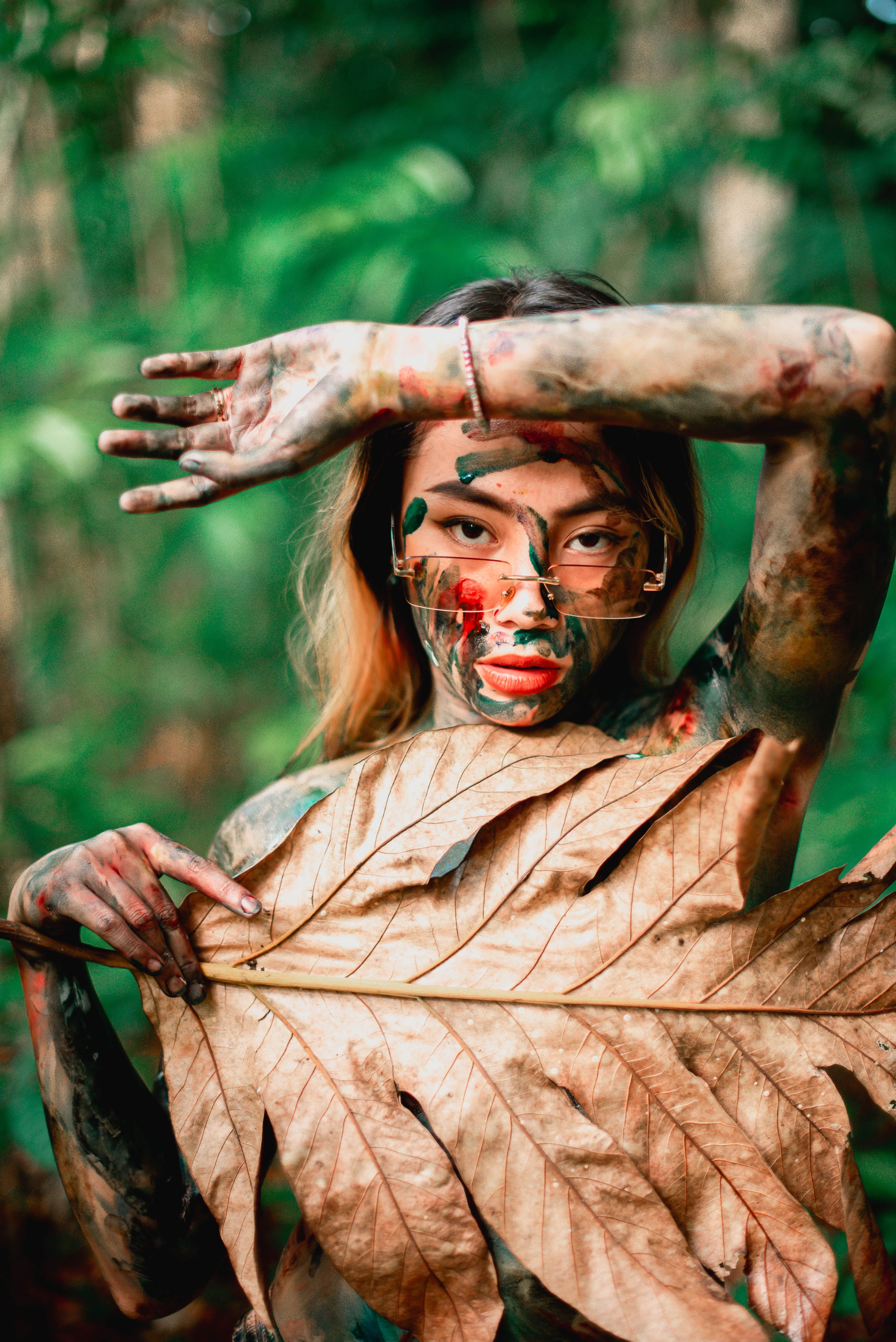 Woman Covering Her Chest with a Brown Leaf · Free Stock Photo