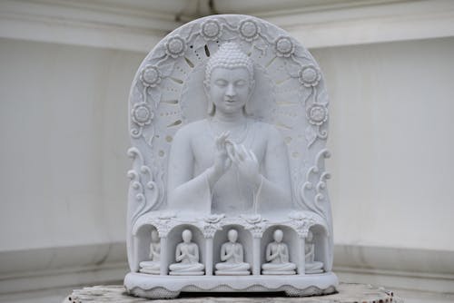 Free A Sculpture of White Marble Gautam Buddha Stock Photo