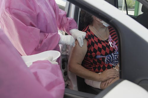 A Woman Getting a Vaccine Shot in Her Arm