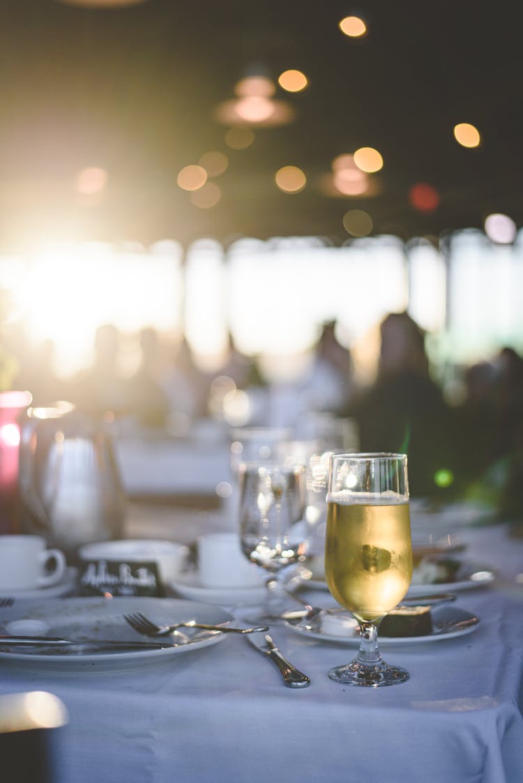 A Glass Of Champagne On A Table