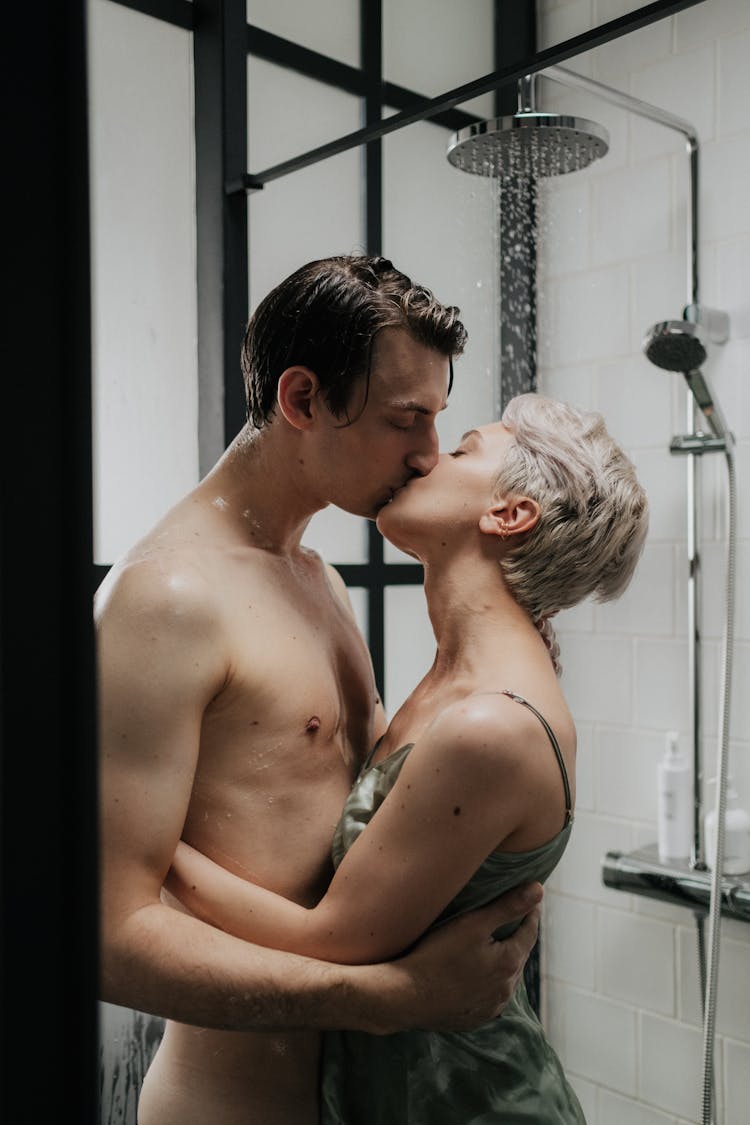 Naked Man And Woman Kissing In The Shower