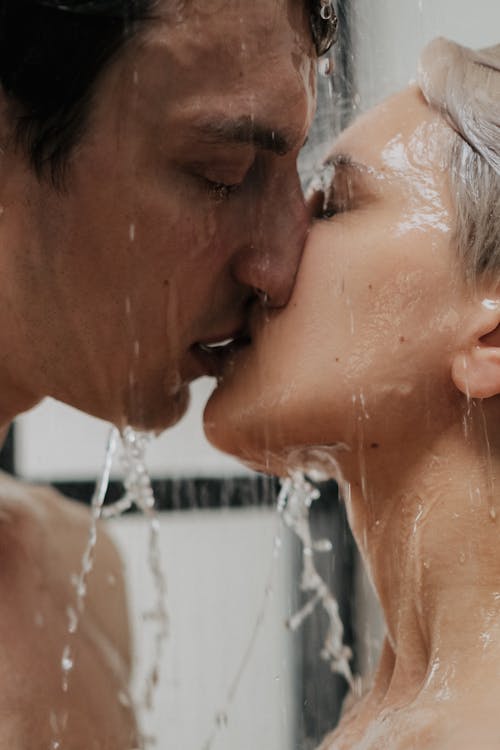 Free Couple Passionately Kissing in the Shower Stock Photo