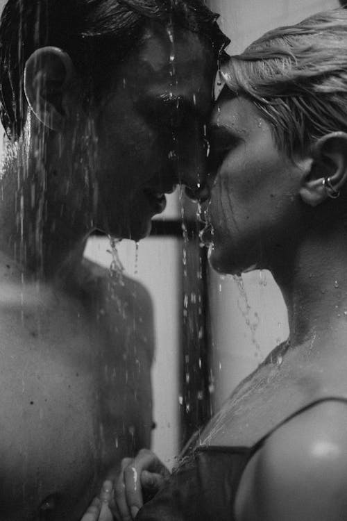 Free A Couple Getting Intimate in the Shower Stock Photo