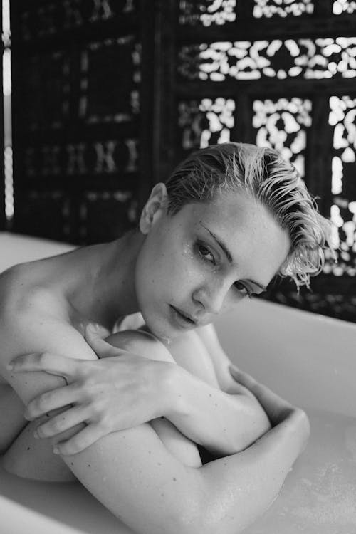 Topless Woman in Bathtub