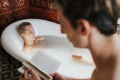 Free A Couple Relaxing in the Bathroom Stock Photo