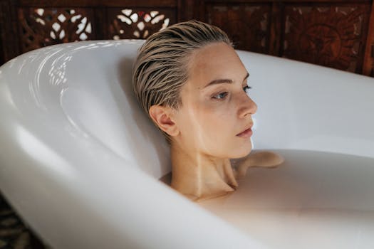 A serene moment of relaxation featuring a woman in a bathtub, highlighting self-care and tranquility.