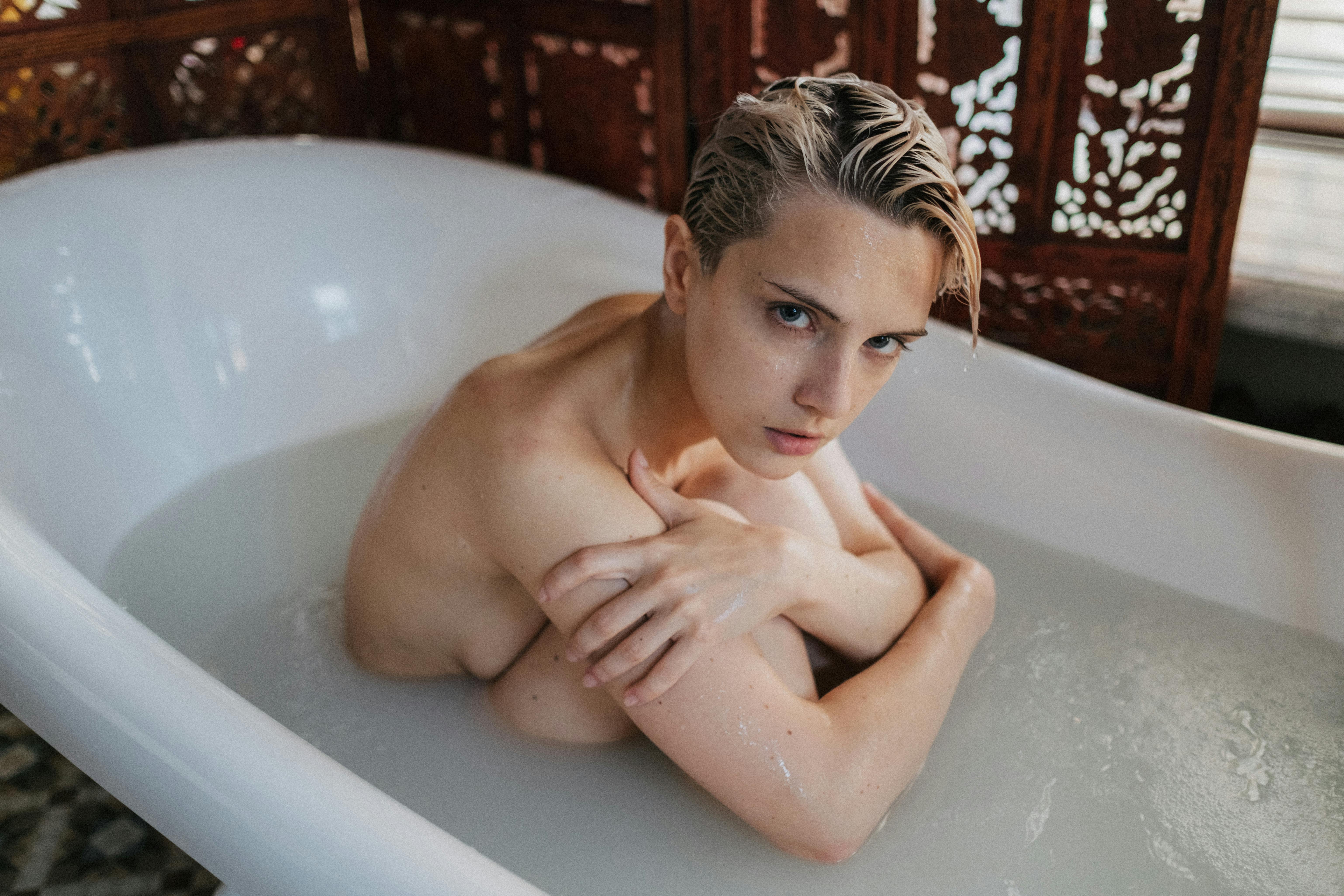 Naked Woman in White Bathtub Embracing Knees · Free Stock Photo