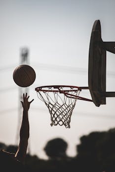 A player makes a dynamic basketball shot outdoors in San Francisco.