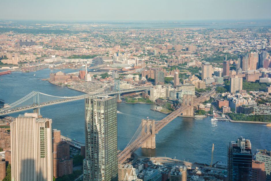 Manhattan Sky Tour: New York Helicopter Flight - Stunning aerial view of the Brooklyn Bridge with Manhattan skyline, showcasing the New York Cityscape.
