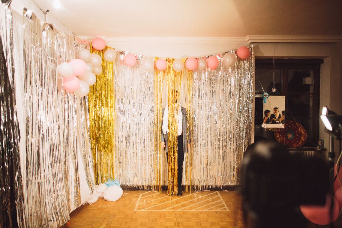 Decorated celebration room with balloons and festive hanging decorations