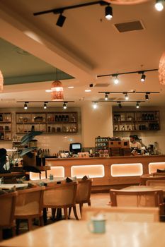 Warm and inviting cafe interior with stylish design and ambient lighting.