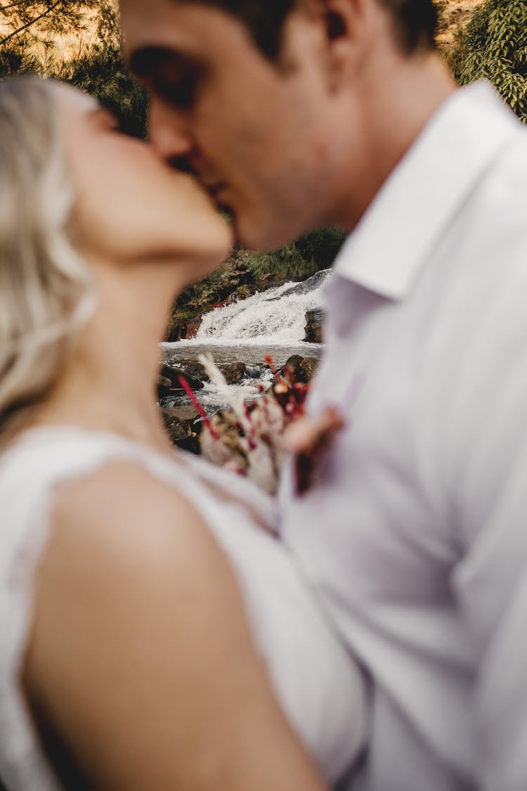 Couple Kissing At Wedding Ceremony