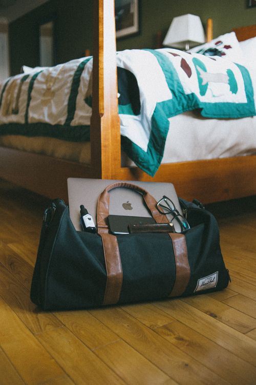 Laptop and Smartphone on a Bag · Free Stock Photo
