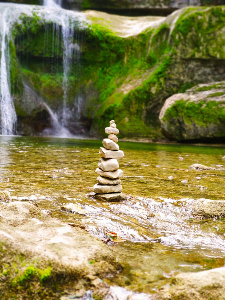 Pyramid Of Gray Stones In Water