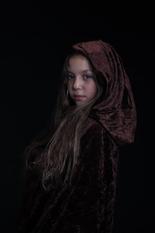 A Girl Wearing a Hooded Cloak