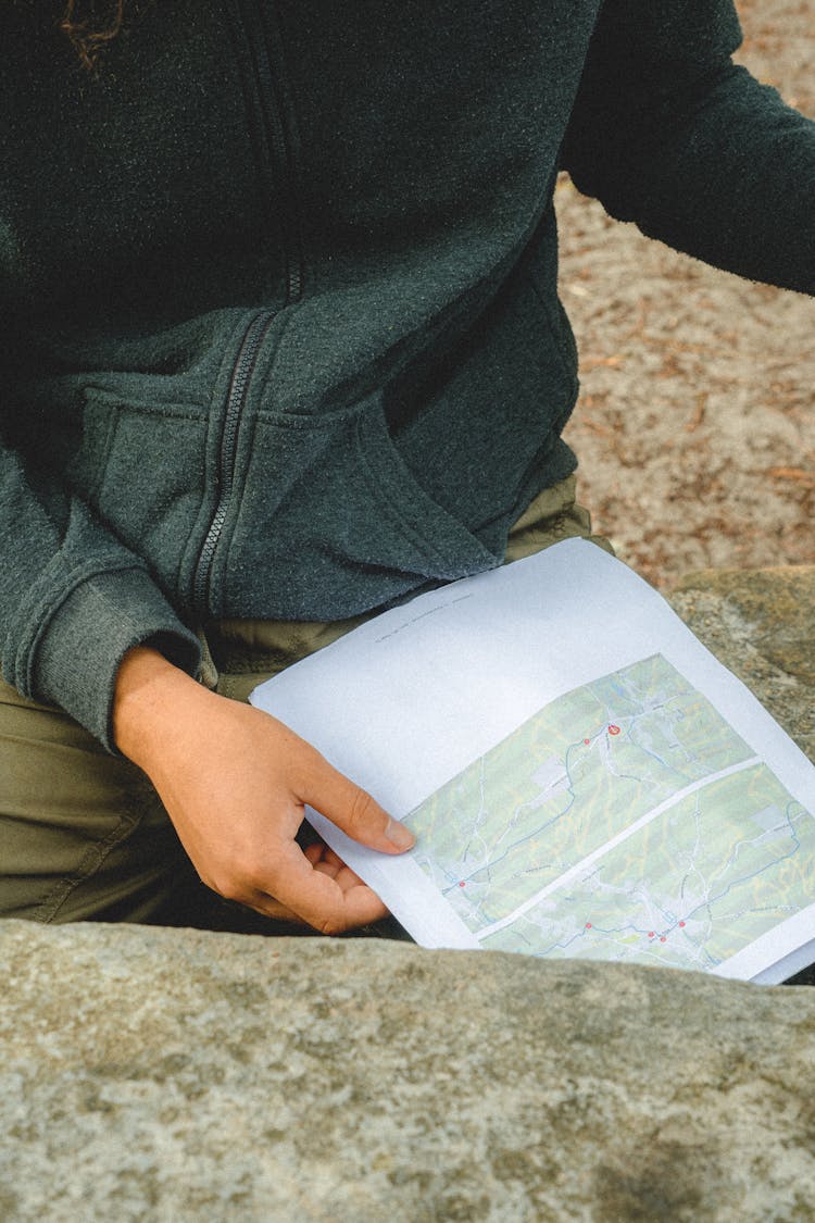 A Person Holding A Map