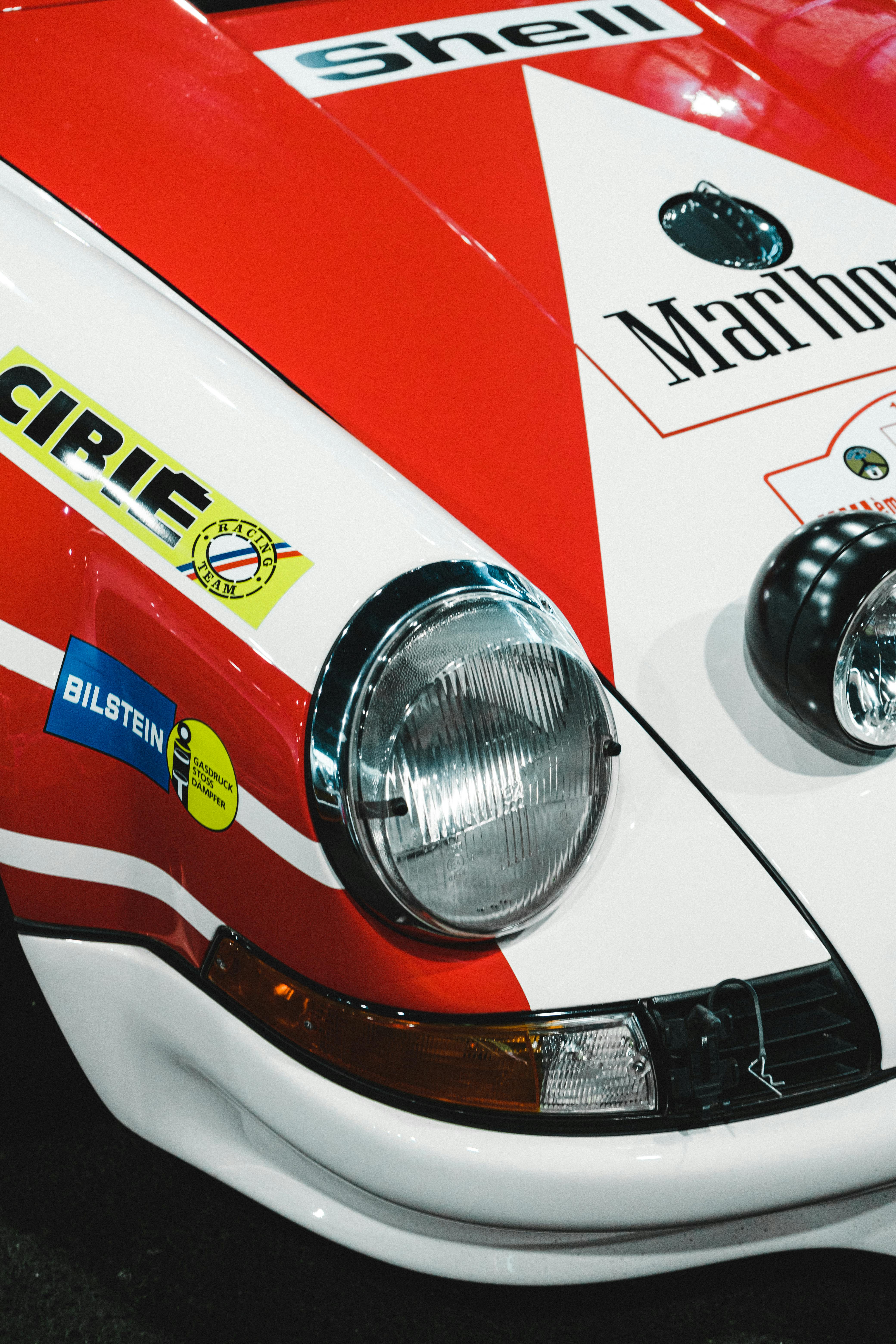 headlight of a red and white racecar