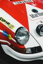 Headlight of a Red and White Racecar