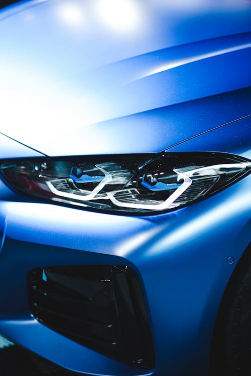 Close-Up Shot of a Blue Car's Headlight
